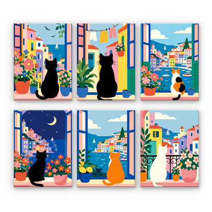 Katzen an mediterranen Fenstern